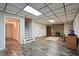Finished basement provides a versatile space with an entertainment area, stairs and extra room at 205 Pine Lake Dr, Cumming, GA 30040