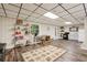 Finished basement featuring a functional kitchenette, workspace, and durable wood-look vinyl flooring at 205 Pine Lake Dr, Cumming, GA 30040