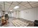 Finished basement with a partial kitchen, desk, and extra room, offering flexible living options at 205 Pine Lake Dr, Cumming, GA 30040