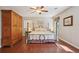 Bedroom with hardwood floors, closet, and natural light at 205 Pine Lake Dr, Cumming, GA 30040