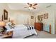 Comfortable bedroom featuring a ceiling fan, double closets, and neutral walls at 205 Pine Lake Dr, Cumming, GA 30040