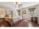 Bedroom with hardwood floors and natural light at 205 Pine Lake Dr, Cumming, GA 30040