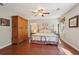 Bedroom with hardwood floors, closet, and natural light at 205 Pine Lake Dr, Cumming, GA 30040