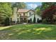 Traditional two-story home with lush front lawn and mature landscaping at 205 Pine Lake Dr, Cumming, GA 30040