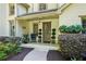 Inviting front porch with stylish decor and beautiful landscaping at 205 Pine Lake Dr, Cumming, GA 30040