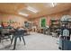 Spacious garage featuring a large work area, storage shelves, and a window at 205 Pine Lake Dr, Cumming, GA 30040