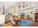 The open living room features a chandelier, staircase, and balcony overlooking the space at 205 Pine Lake Dr, Cumming, GA 30040