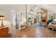 Spacious living room features hardwood floors, a stone fireplace, and an open concept layout at 205 Pine Lake Dr, Cumming, GA 30040