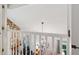 Loft featuring an open view to a living area below with a stone fireplace at 205 Pine Lake Dr, Cumming, GA 30040