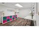 Bright basement office or craft room with modern shelving and plenty of natural light at 205 Pine Lake Dr, Cumming, GA 30040