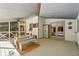 Covered porch featuring a ceiling fan, white railings and a nice table and bench set at 205 Pine Lake Dr, Cumming, GA 30040