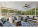 Relaxing porch with comfortable seating and an outdoor swing overlooking the backyard area at 205 Pine Lake Dr, Cumming, GA 30040