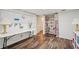 Basement craft area features a large pegboard, closet and shelving, and colorful storage solutions at 205 Pine Lake Dr, Cumming, GA 30040
