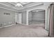 Spacious bedroom features a tray ceiling and arched entry to an additional room at 65 Pecan Ln, Oxford, GA 30054