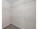 Walk-in closet with wire shelving and carpeted floor at 65 Pecan Ln, Oxford, GA 30054