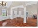 Elegant foyer with gleaming hardwood floors, high ceilings, and decorative molding at 65 Pecan Ln, Oxford, GA 30054