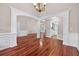 Spacious living area with hardwood flooring, decorative columns, and an open layout at 65 Pecan Ln, Oxford, GA 30054