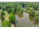 Scenic aerial view featuring a tranquil pond surrounded by lush greenery, offering a peaceful retreat at 958 Forrest Blvd, Decatur, GA 30030
