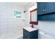 A bathroom includes a vanity and a tub with white tile at 958 Forrest Blvd, Decatur, GA 30030