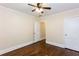 A simple bedroom has a ceiling fan, plus a view to a hallway at 958 Forrest Blvd, Decatur, GA 30030
