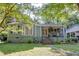 Charming single Gathering home with lovely landscaping and a cozy covered front porch at 958 Forrest Blvd, Decatur, GA 30030