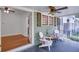 Inviting front porch featuring comfortable seating, a ceiling fan, and stylish decor at 958 Forrest Blvd, Decatur, GA 30030