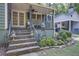Cozy covered front porch with stone stairs, ideal for relaxing and enjoying the outdoors at 958 Forrest Blvd, Decatur, GA 30030