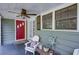 Inviting front porch with a red door, perfect for relaxing and enjoying the outdoors at 958 Forrest Blvd, Decatur, GA 30030