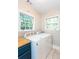 A well-lit laundry room includes two washing machines and a bright window at 958 Forrest Blvd, Decatur, GA 30030