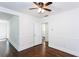 Corner of an open living room showing hardwood floors, half wall, and doorway to bedroom at 958 Forrest Blvd, Decatur, GA 30030