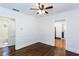 Corner of an open living room showing hardwood floors, half wall, doorways, and bathroom at 958 Forrest Blvd, Decatur, GA 30030