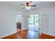 Corner of an open living room showing hardwood floors, half wall, doorways, and porch at 958 Forrest Blvd, Decatur, GA 30030