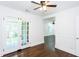 Corner of an open living room showing hardwood floors, doors, and passageway to living area at 958 Forrest Blvd, Decatur, GA 30030