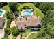 Expansive estate showcasing stunning home, lush lawn, pool, spa, outdoor kitchen, and cabana at 170 Autry Trl, Johns Creek, GA 30022