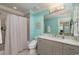 Bathroom boasts designer wallpaper, a large mirror, and updated fixtures at 170 Autry Trl, Johns Creek, GA 30022