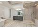 Beautiful bathroom showcasing a glass-enclosed shower, standalone tub, and dual sink vanity at 170 Autry Trl, Johns Creek, GA 30022