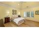 This cozy bedroom is bright with fresh light, neutral colors, and hardwood floors at 170 Autry Trl, Johns Creek, GA 30022