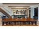 Eat-in kitchen and dining area with wood flooring, exposed wood beams, and modern lighting at 170 Autry Trl, Johns Creek, GA 30022
