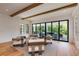 Bright living room boasts hardwood floors, and large windows and sliders leading to outdoor living spaces at 170 Autry Trl, Johns Creek, GA 30022