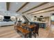 Open concept living room with eat-in kitchen and dining area with hardwood flooring and modern lighting at 170 Autry Trl, Johns Creek, GA 30022