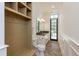 Mudroom bathroom with built-in storage, wainscoting, and tiled floors at 170 Autry Trl, Johns Creek, GA 30022