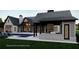 A stunning backyard featuring a pool, outdoor kitchen, and cabana for luxurious living at 4585 Ryker Rd, Cumming, GA 30041