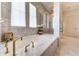 Spa-like bathroom features marble finishes, soaking tub, and a glass-enclosed shower, perfect for relaxation at 4585 Ryker Rd, Cumming, GA 30041