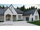 An exterior view of the new home with a three car garage, lush lawn and impeccable design at 4585 Ryker Rd, Cumming, GA 30041