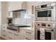 Gourmet kitchen showcases stainless steel appliances and custom cabinetry, designed for both function and style at 4585 Ryker Rd, Cumming, GA 30041
