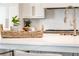 Bright kitchen featuring a white countertop, pot filler faucet and stainless steel range at 4585 Ryker Rd, Cumming, GA 30041