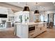 Open-concept kitchen featuring a large island with ample counter space and modern appliances at 4585 Ryker Rd, Cumming, GA 30041