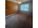 Bedroom with neutral walls, ceiling fan, and lots of natural light at 1365 Rockmart Rd, Villa Rica, GA 30180