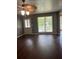 Spacious living room with hardwood floors, ceiling fan, and lots of natural light at 1365 Rockmart Rd, Villa Rica, GA 30180
