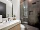 Modern bathroom with walk-in shower and floating vanity at 191 Darwish Dr, Mcdonough, GA 30252